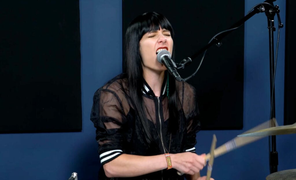 Drums Vs. Guitar: Here's The One You Should Learn 7 heather thomas singing while drumming